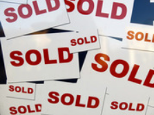 Sold signs representing property and asset disbursement
